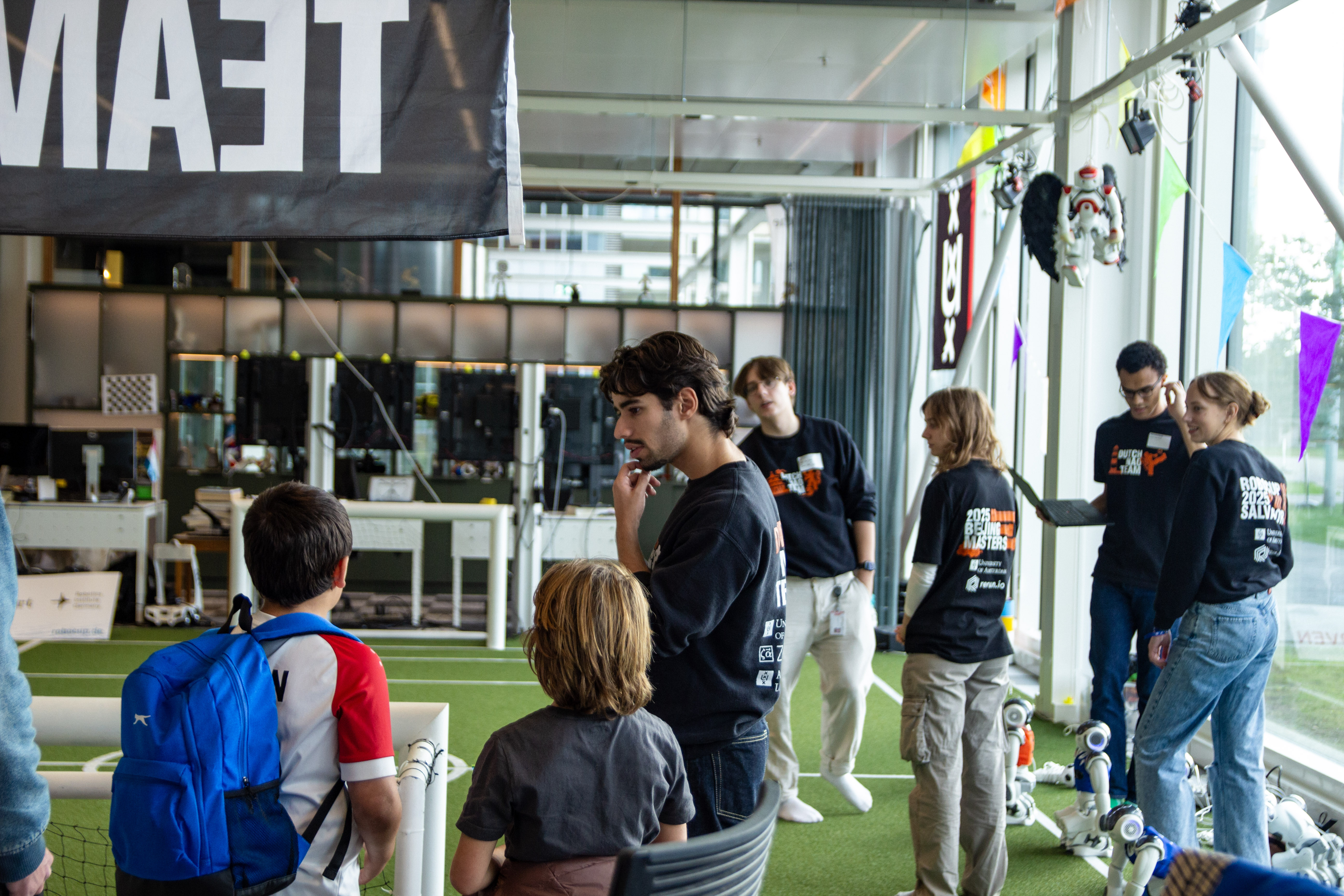 Team members giving a demo to visitors in the Lab