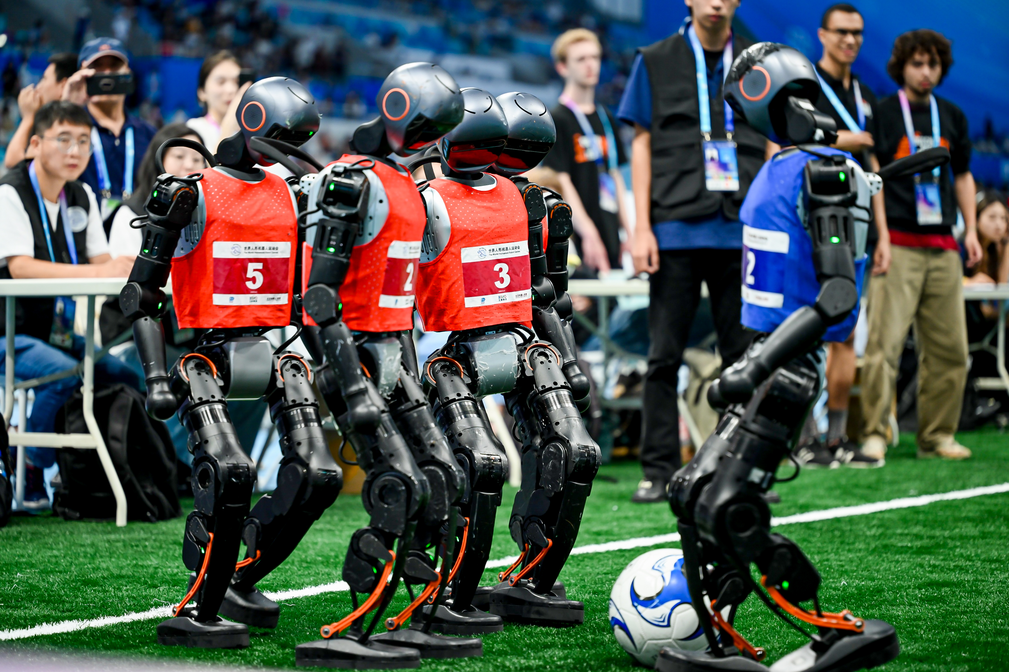 Robots waiting to take a free kick